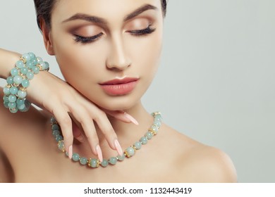 Female face closeup. Manicure, bijou and makeup. Beautiful girl portrait - Shutterstock ID 1132443419