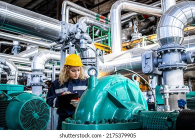 Female Factory Worker Checking Generators And Maintenance Of Pipeline Inside Oil Refinery.