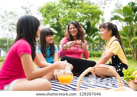 Female family having picnic outdoors