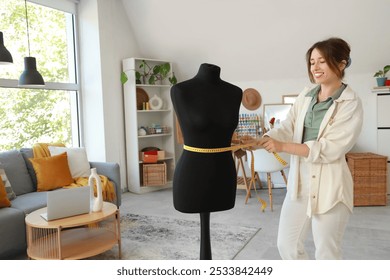 Female fashion designer measuring mannequin in studio - Powered by Shutterstock