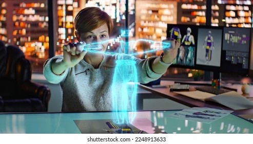 Female Fashion Designer Working with Holographic Augmented Reality 3D Model. Young Woman Creating New Clothing Collection. Scientific Technology. Fashion and Art Concept. . High quality photo - Powered by Shutterstock