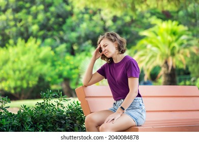 Female Feeling Headache On The Street. Stressed Woman Outside