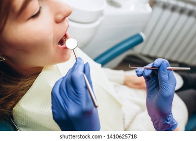 Female Feeling Painful Toothache. Teeth Problem Woman Feeling Tooth Pain. Social Medicine, Budget Dental Clinic In Poor Countries. Dentist Examining A Patient's Teeth In The Dentist.