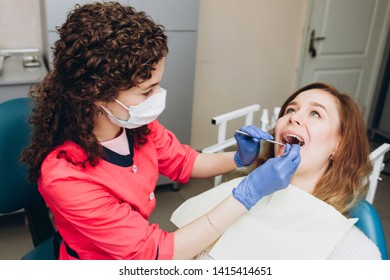 Female Feeling Painful Toothache. Teeth Problem Woman Feeling Tooth Pain. Social Medicine, Budget Dental Clinic In Poor Countries. Dentist Examining A Patient's Teeth In The Dentist.