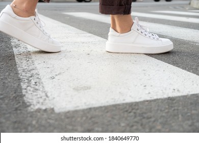 
Female Feet Crossing The Crosswalk