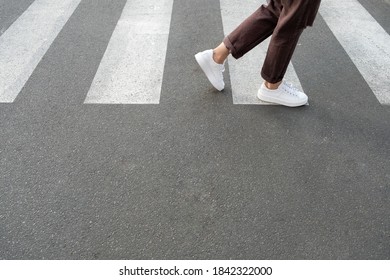 
Female Feet Crossing The Crosswalk