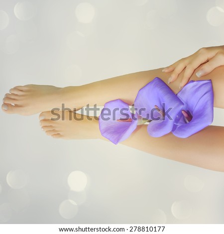 Female feet with flower