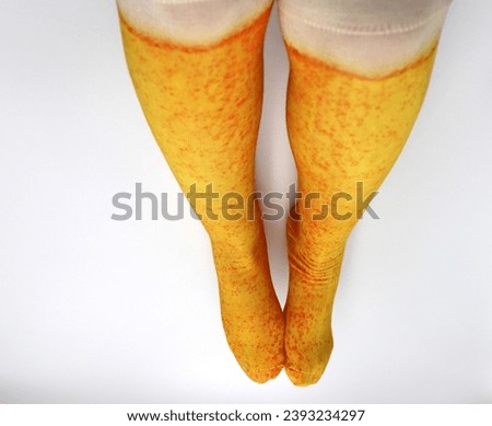 Female feet and legs with long beer stockings socks fun dress up costume clothing on white background