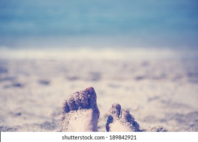 Female Feet On A Sandy Beach, Instagram Effect, Point Of View