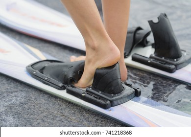 Female Feet Slipping Into Water Skis