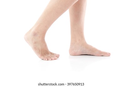 Female Feet Walking On White Background Isolated