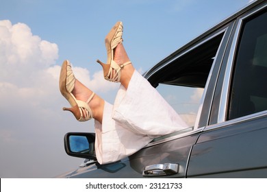 Female Feet In Window Of Car