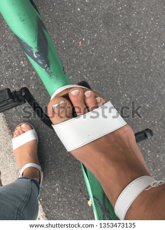 female feets on bicycle