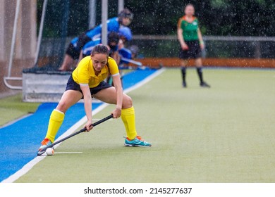 Female Field Hockey Player Performing Penalty Shot 