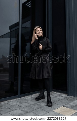 Attractive blond woman leaving her workplace