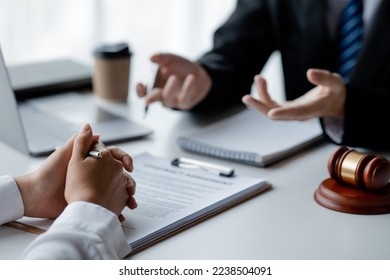 A female financier is reviewing company financial documents, monthly financial statement summary from the finance department. The concept of managing the company's finances for accuracy and growth. - Shutterstock ID 2238504091