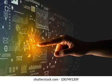 Female finger touching beam light surrounded by charts   graphs