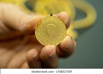 Female Fingers Holding 24 Carat Gold (Turkish Gold)