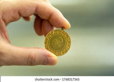 Female Fingers Holding 24 Carat Gold (Turkish Gold)