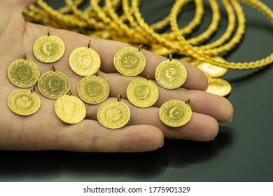 Female Fingers Holding 24 Carat Gold (Turkish Gold)