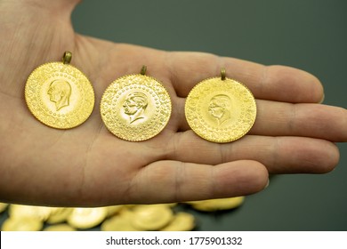 Female Fingers Holding 24 Carat Gold (Turkish Gold)