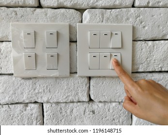 Female Fingers Are Turning Off The Power Switch.