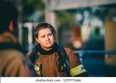 Female Firefighter Dressed In Turnouts. 