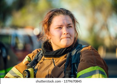 Female Firefighter Isolated In Full Bunker Gear After A Fire. 