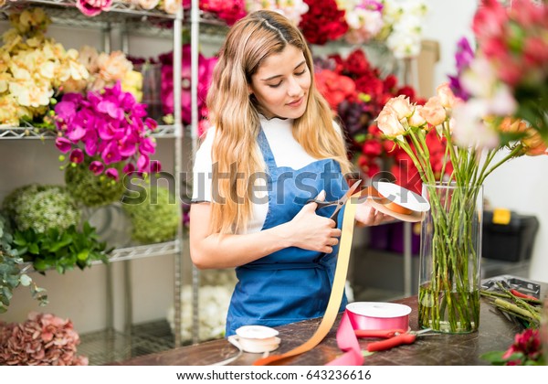 Female Florist Cutting Ribbon Decorate Flower Stock Photo Edit