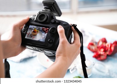 Female Food Photographer Working In Home Studio, Closeup