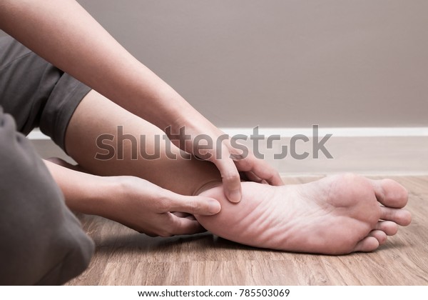 Female foot heel pain,\
plantar fasciitis