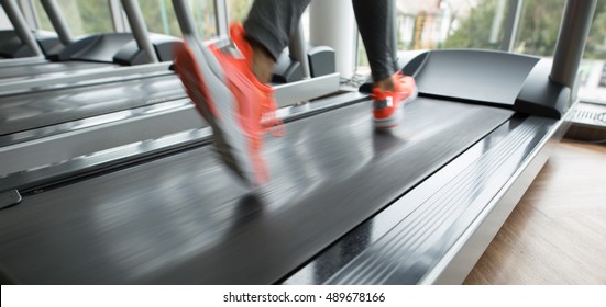 Female Foot Running On Treadmill - Motion Blur