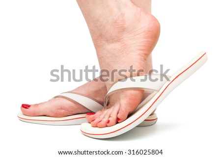 female foot in sandal on a white background