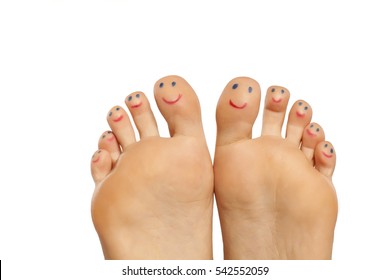 female foot and smiles drawn on the toes
