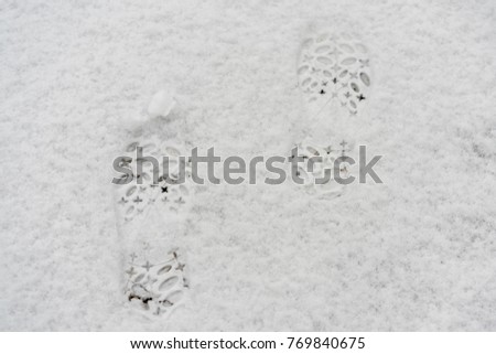 female footprints in the snow