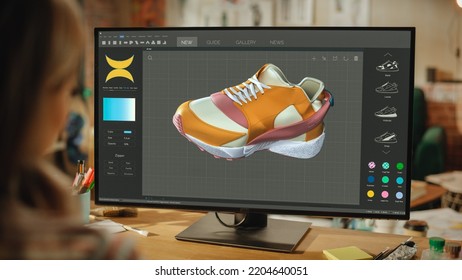 Female Footwear Designer Creating And Rendering 3d Model Of Stylish Shoe. Working On Powerful Desktop Computer In Creative Space. Sneaker Production Process Concept. Over The Shoulder.