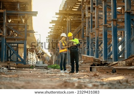 A Female Foreman Inspecting Objects at New Concrete Road and Bridge Construction Site, road Traffic is Critical Infrastructure. Foto stock © 