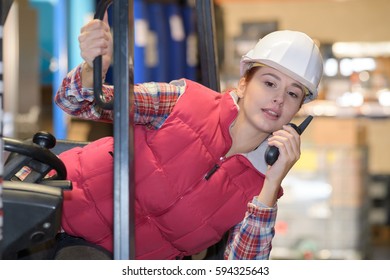 Female Fork Lift Truck Driver Working In Factory