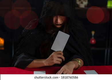 Female fortune teller read tarot cards to predict fortune.