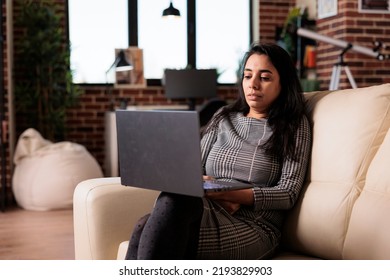 Female Freelancer Working On Laptop At Home, Attending Online Class Lesson Or Doing Remote Business Work On Computer. Using Pc To Browse Internet For Research, Virtual Webinar.