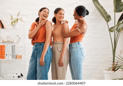 Female friends after receiving covid vaccine, happy and smiling, approving the immunity injection showing bandage plaster arms. Diverse women recommend booster jab for protection from corona virus. - Powered by Shutterstock