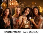 Female Friends Celebrating At Party Make Toast To Camera