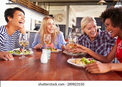 Female Friends Eating At A Restaurant