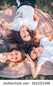 Female Friends Enjoying A Picnic In Nature.