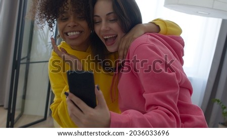 female friends fooling around at home