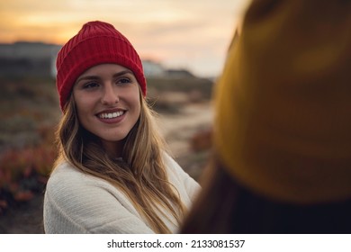 Female Friends Sitting Outside Having A Chat