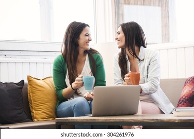 Female Friends Studying At The Local Coffee Shop