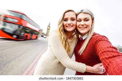 Female Friendship Concept With Girls Couple Taking Selfie Outdoors In London - Lgbtq Genuine Love Relationship With Happy Millenial Women Girlfriends Having Fun Together - Bright Warm Filter