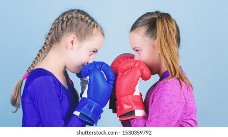 Female friendship. Girls in boxing sport. Boxer children in boxing gloves. Girls cute boxers on blue background. Friendship as battle and competition. Pass boxing challenge. Test for fortitude. - Shutterstock ID 1530359792
