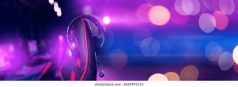 Female gamer streaming setup with neon lights and gaming chair in focus.